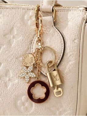 Authentic Louis Vuitton Gold Lock & Key with unbranded Clover Flower Bagcharm